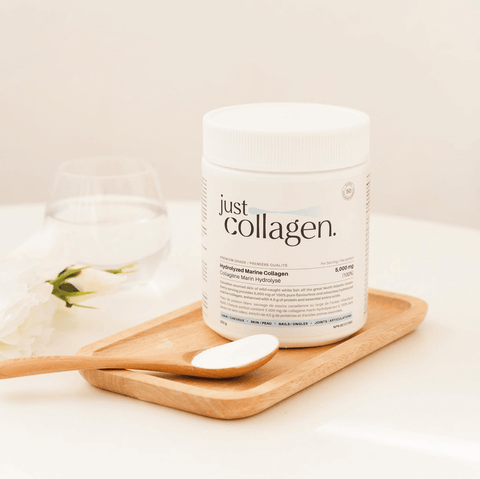 Just Collagen Hydrolyzed marine collagen powder on tray with spoon, product lifestyle shot